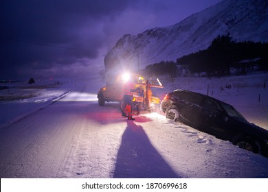 Car Being Towed After Accident In Snow Storm