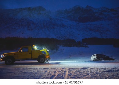 Car Being Towed After Accident In Snow Storm