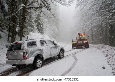 Car Being Towed After Accident In Snow Storm