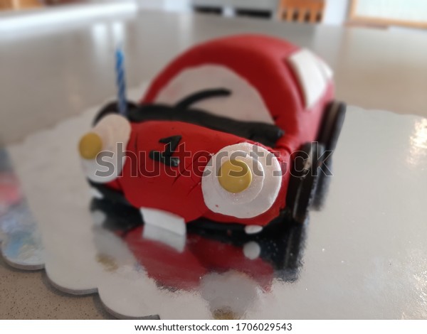 car bithday cake with a\
number one on