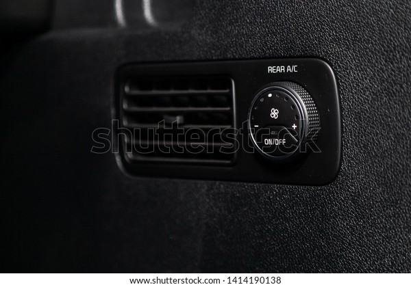 Сlose-up of the car  black interior:  dashboard,\
air conditioner  for rear\
seats