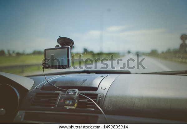 car and blue sky with\
blurred clouds.