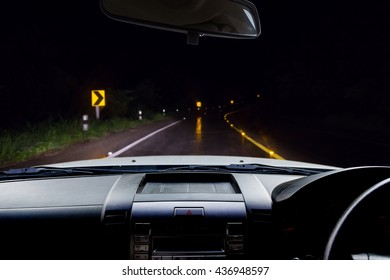 In The Car, Blur Image Of The Road In The Rain Forest At Dark Night As Background.