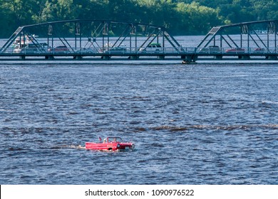 A Car Boat Floating In The St. Croix River Near The Stillwater Lift Bridge.