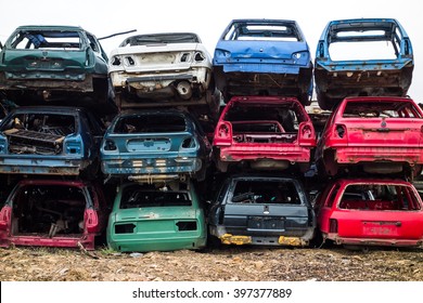 Car bodies stacked at the junkyard - Shutterstock ID 397377889