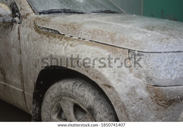 Car body is covered with soap foam to remove dirt
from the body