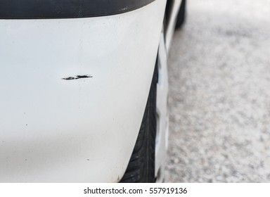 Car Body Damage, White Rear Bumper, Paint Scratch.