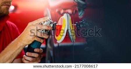 car body repair and detailing workshop. man polishing vehicle paint. copy space
