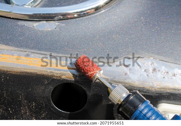 Car body repair with your own hands.\
Step 2. Removing rusty spots with a manicure\
machine.