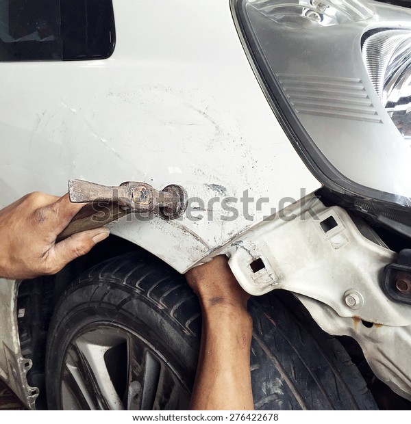 Car body\
work auto repair paint after the\
accident.