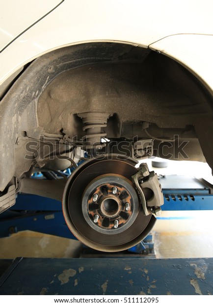 Car brake disc without\
wheels closeup