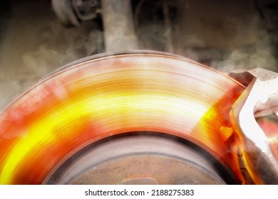 Car brake discs rub against the brake pads until high heat and smoke. - Shutterstock ID 2188275383