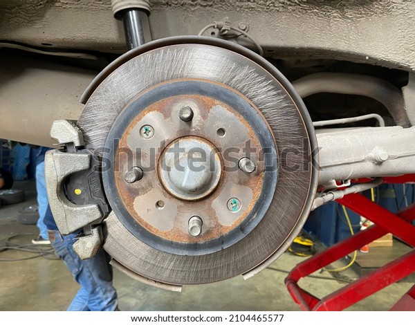 Car brake pads being\
repaired.