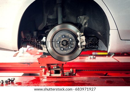 car brake part at garage,car brake disc without wheels closeup