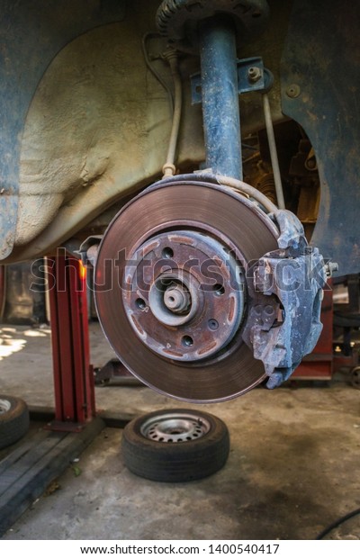 Car brakes disc in\
mechanical maintenance