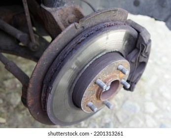 Car Brakes Inspection. Brake Rotor Disc With Corrosion Close Up