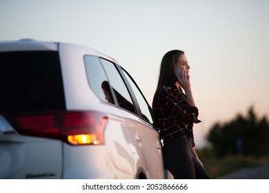 Car Breakdown On Road. Young Desperate Woman Calling Emergency Help Near Broken Car On Road. Help Needed. Car Service.