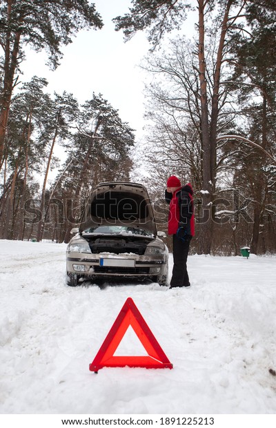 car broken on a snowy winter road , Winter car\
breakdown ,