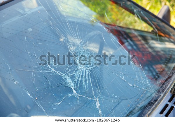car with
broken windshield close-up. road
accident