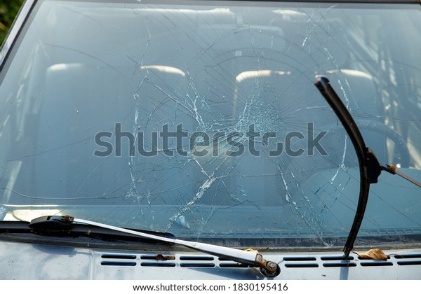 car with\
broken windshield close-up. road\
accident