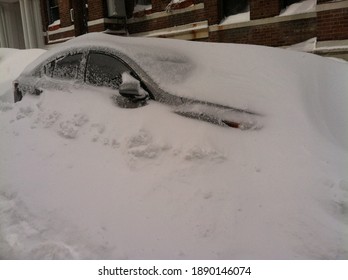 Car Buried Under Snow Following A Major Nor’Easter Blizzard In Boston, Massachusetts