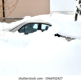 Car Buried In Winter Snow Storm Outdoors.