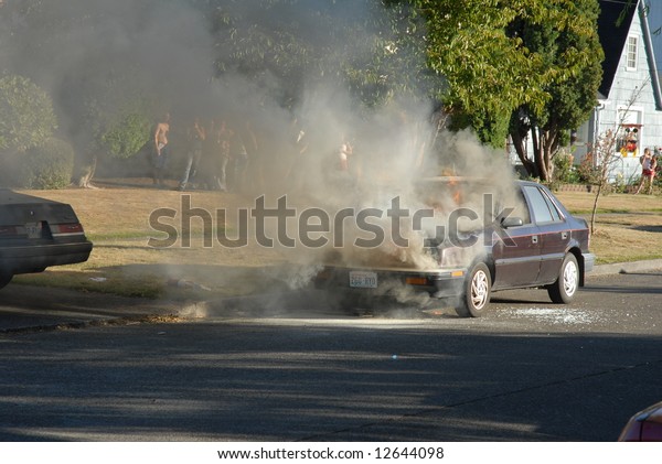 A car is burning on the street. The story\
of a firefighter putting out the\
fire.