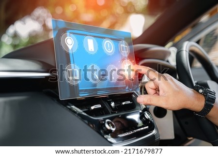 Car business concept and technology on virtual screen, Close up hand a man touch on the monitor screen of car setting car system for lifestyle my self,inside the car with multimedia and technology 
