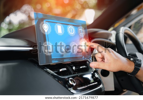 Car business concept and technology on virtual screen,\
Close up hand a man touch on the monitor screen of car setting car\
system for lifestyle my self,inside the car with multimedia and\
technology 