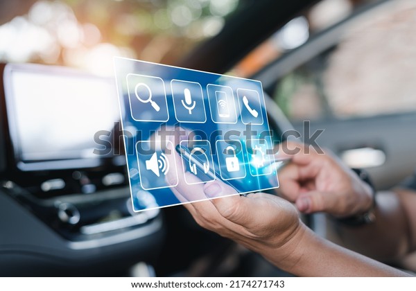 Car\
business concept and technology on virtual screen,Close up hand a\
man touch on smartphone connecting car system for lifestyle my\
self, inside the car with multimedia and technology\
