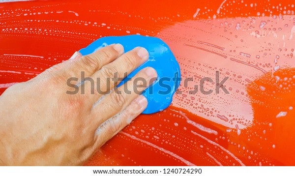 Car Care or Car Detailing Process.\
Using Clay Bar to Remove dust and Dirt on the\
surface.
