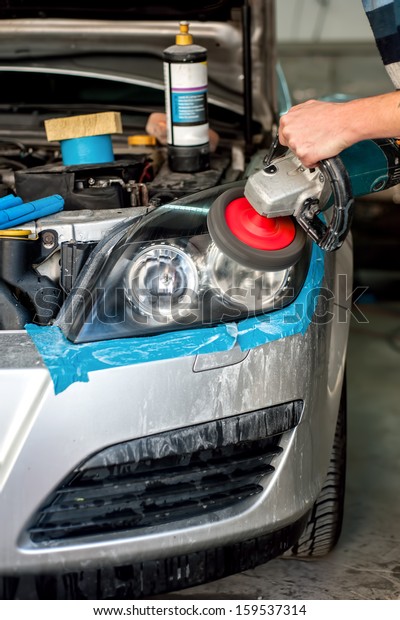Car Care with Car headlight cleaning with\
power buffer machine at service\
station
