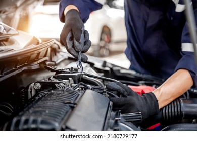 Car care maintenance and servicing, Close-up hand technician auto mechanic using the wrench to repairing change spare part car engine problem and insurance service support. - Shutterstock ID 2180729177