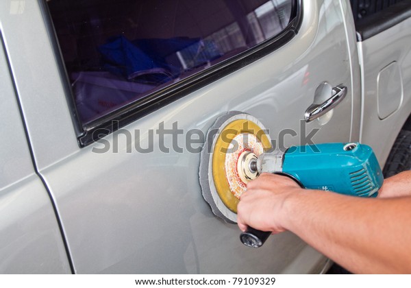 Car care with power buffer
machine . CAR CARE images closeup Useful as background for
design-works.