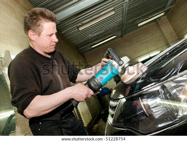 car\
care work with machine polisher at service\
station