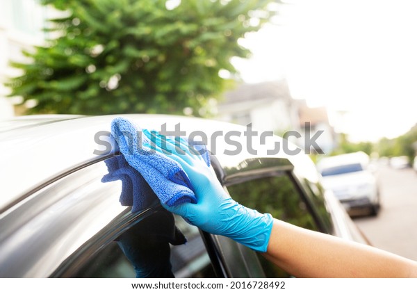 Car care workers cleaning
the car