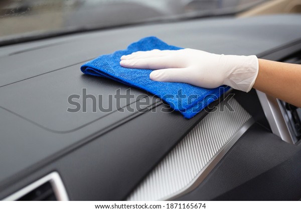 Car care\
workers wash, spray and clean the\
car.