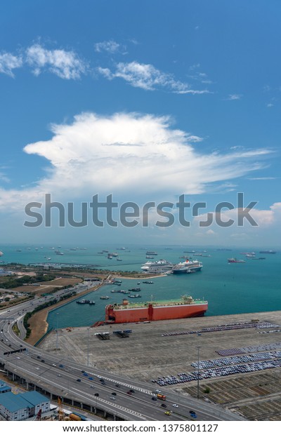 Car carrier ship\
with blue sky background