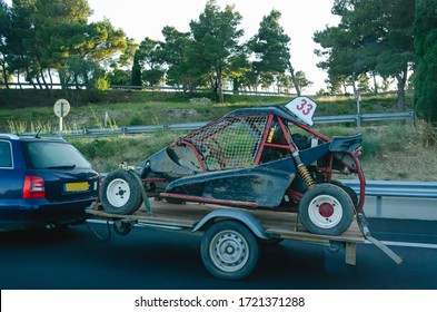 Car Carrying Trailer With An UTV Off-road Vehicle On Highway Road 