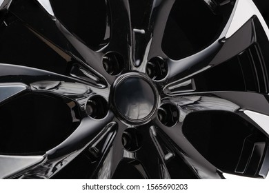 car cast aluminum alloy wheels, black silver with polished front, very beautiful and modern, fashion. Close-up on dark background, elements, spokes. - Shutterstock ID 1565690203