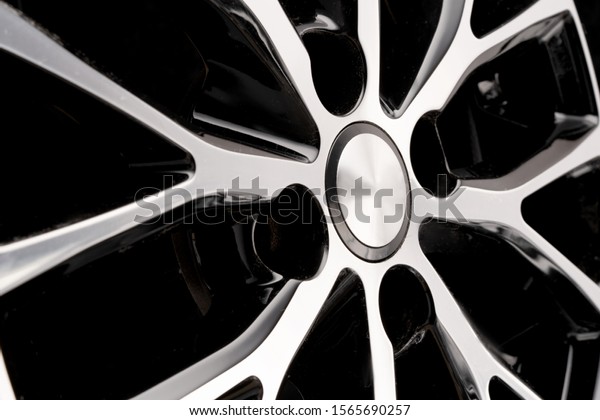 car cast aluminum alloy wheels, black\
silver with polished front, very beautiful and modern, fashion.\
Close-up on dark background, elements,\
spokes.