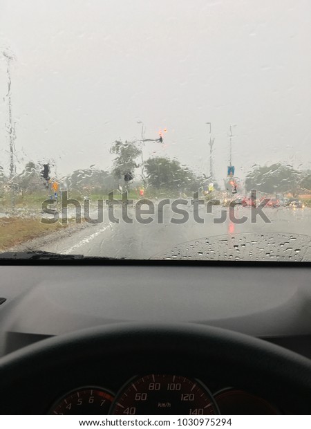 In the car, caught in the\
rain