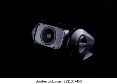 Car CCTV dash camera for safety on the road to record accidents. Front and rear lenses on black background - Shutterstock ID 2221309453