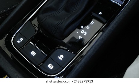 Car center console, gear shift and buttons, illuminated, close-up. - Powered by Shutterstock