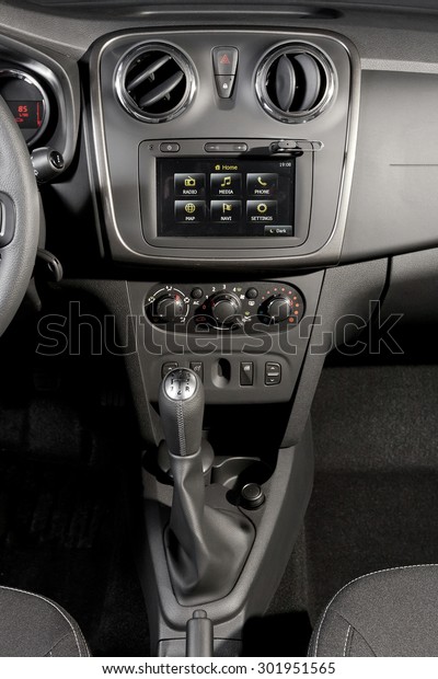 Car central console with central infotainmet\
screen and USB stick\
inserted