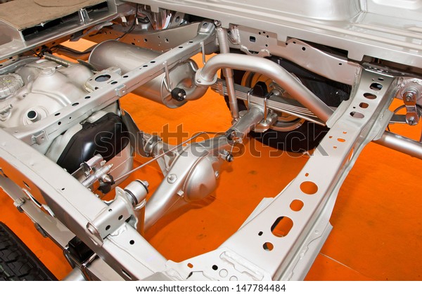 Car\
chassis with engine. Image of car chassis with\
engine
