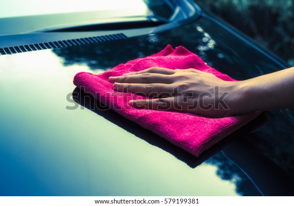 Car cleaning by hand with microfiber cloth, Car care\
cleaning. 