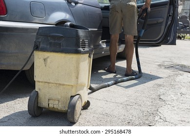 Car Cleaning By A Vaccuum Cleaner

