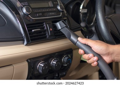 Car Cleaning Details - Man Vacuuming In Car Cabin Professional Car Interior Upholstery Vacuum Cleaner For Dirty Car Interiors.