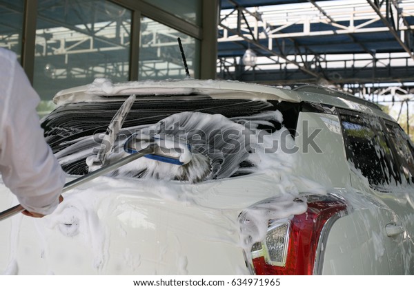 Car\
cleaning with car foam / Car cleaning with car\
foam